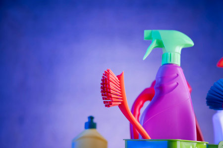 Cleaning products on blue background. House cleaning concept. Selective focus.の写真素材