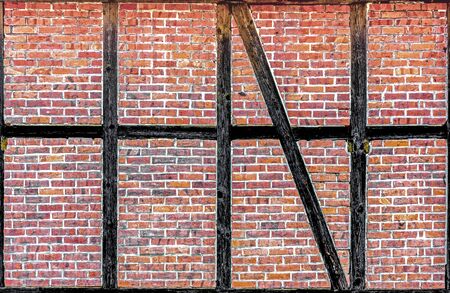 An old brick wall with wooden beamsの写真素材