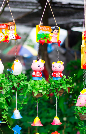 Hanging flower pot and teedy bird in the park , Thailand.のeditorial素材