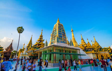 YANGON,MYANMAR-MARCH 15.2017: Buddhist Pilgrims in the Shwedagon Pagoda at night. It is the most sacred Buddhist pagoda for the Burmese.のeditorial素材