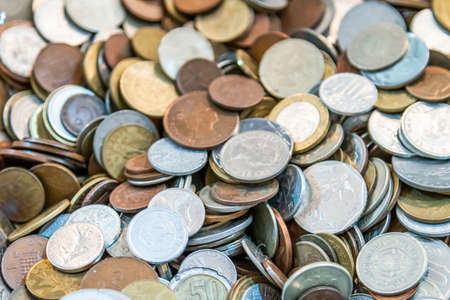 Old antique coins on display in antique shopの写真素材