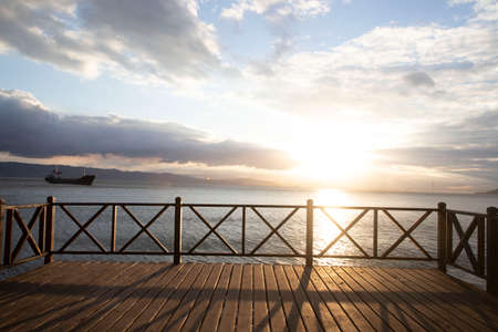 View of wooden railing and viewing terrace at the seaside, Turkeyの写真素材