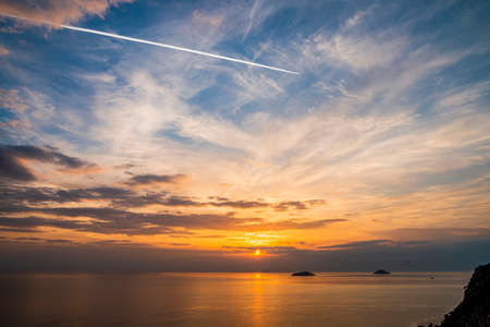 Romantic Natural Sunset Sunrise Over Field Or Meadow. Bright Dramatic Sky And Dark Ground. Countryside Landscape Under Scenic Colorful Sky At Sunset Dawn Sunrise. Sun Over Skyline, Horizonの写真素材