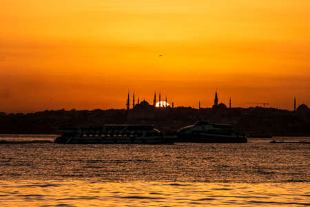 Cityscape of Istanbul with silhouettes of ancient mosques and minarets at sunset. Panoramic view, The Maiden's Tower, Galata Tower, Hagia Sophia, The Blue Mosque and TopkapÄ± Palace in Istanbul.のeditorial素材