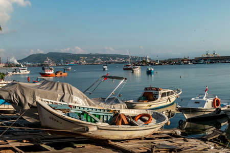 Zonguldak eregli district, fishing boats and erdemir iron and steel factory behind, June 24,2019, Eregli, Zonguldak, Turkeyのeditorial素材