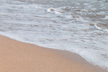 sea ripples hit the beach