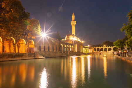 Sanliurfa, Turkey - June 19, 2023 : BalÄ±klÄ±gÃ¶l (BalÄ±k Lake) and Rizvaniye Mosque Landscape in beautiful sunset scenery in ÅanlÄ±urfa, Turkey.のeditorial素材