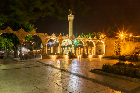 Sanliurfa, Turkey - June 19, 2023 : BalÄ±klÄ±gÃ¶l (BalÄ±k Lake) and Rizvaniye Mosque Landscape in beautiful sunset scenery in ÅanlÄ±urfa, Turkey.のeditorial素材