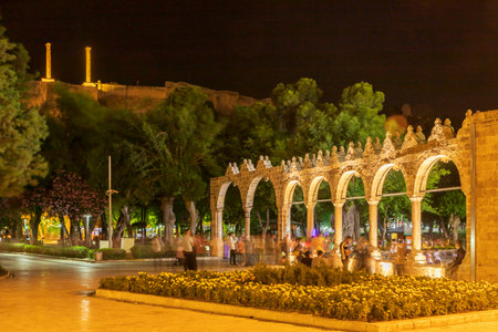 Sanliurfa, Turkey - June 19, 2023 : BalÄ±klÄ±gÃ¶l (BalÄ±k Lake) and Rizvaniye Mosque Landscape in beautiful sunset scenery in ÅanlÄ±urfa, Turkey.のeditorial素材