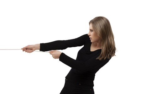 woman pulling a thread, communication conceptの写真素材