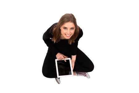 girl sitting with tablet on a white background