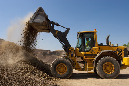 bulldozer in action in a big quarry