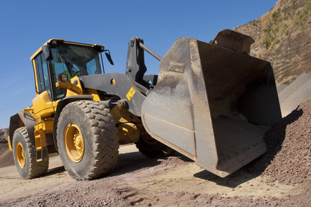 bulldozer in action in a big quarry