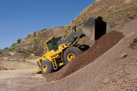 bulldozer in action in a big quarry