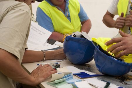 bib and blue helmet protection for workersの写真素材