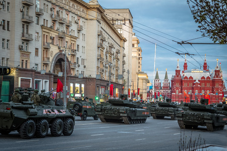 Moscow - Russia 4 May, 2015: Armata T-14 main battle tank unique, next generation heavy military vehicle, combat platform with soldiers and people on roadside for see the parade rehearsal on May 4, 2015 in Tverskaya street  Moscow.のeditorial素材
