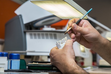 Dental laboratory manufacturing dental prosthesesの写真素材