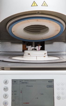 oven and press for ceramic dental prostheses, in actionの写真素材