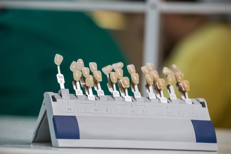 Closeup of tooth color palette for color matching Choice of color of a artificial tooth, and teeth whiteningの写真素材
