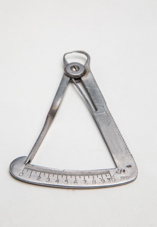 a used caliper gauge for precision measurementsの写真素材