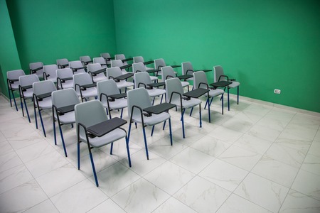 chairs lined up in a classroom for trainingの写真素材