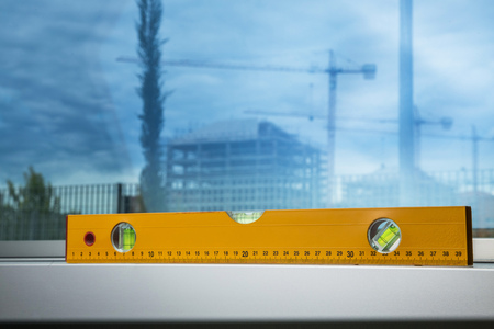 yellow level with a construction yard with a craneの写真素材