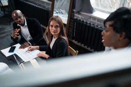 african-american lady business trainer coach leader give flip chart presentation consulting clients...