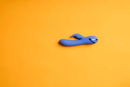 Blue dildo on a yellow background. Banner for sex shopの写真素材