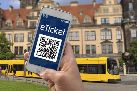 Hand with smartphone showing e ticket