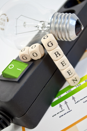 Plug bar with a tree in a light bulb and cubes go greenの写真素材