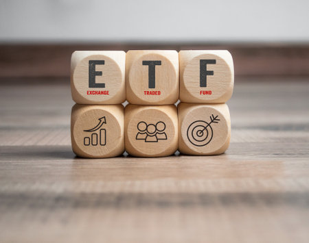 Cubes, dice or blocks with acronym ETF - Exchange traded fund on wooden backgroundの写真素材