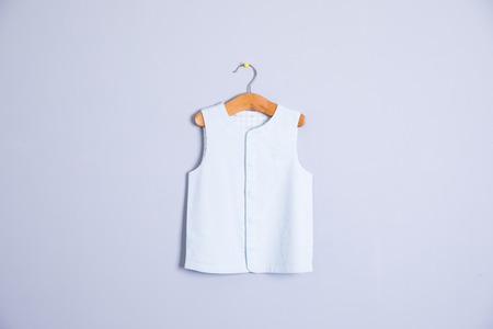 Baby clothes and accessories on wooden backgroundの写真素材