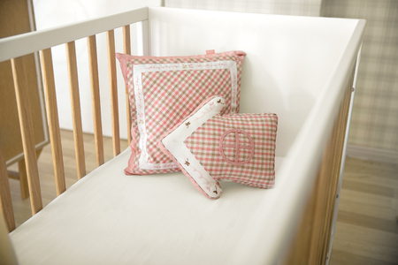Stack of colorful decorative funny pillows isolatedの写真素材