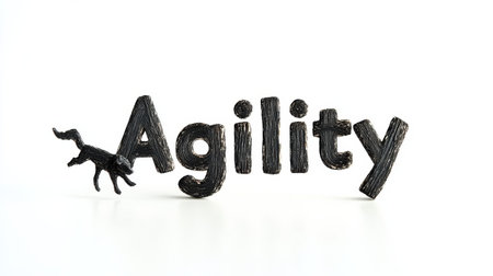 The artwork creatively illustrates the concept of agility, featuring a dog mid-leap alongside stylized lettering. This representation highlights movement and grace.の素材