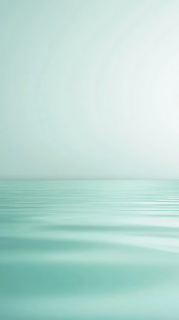 Gentle ripples on a tranquil water surface reflect a soft light, creating a peaceful setting ideal for meditation or quiet reflection, capturing the essence of calmness.の素材