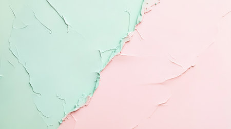 Fresh green paint on one side contrasts with soft pink on the other, creating a textured wall in a modern interior. The blending of colors adds a contemporary touch to the space.の素材