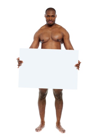 Naked black man hiding behind blank white billboard. Copyspaceの写真素材