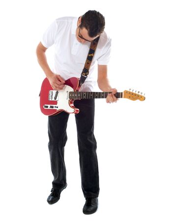 Handsome casual man with guitar looking down. Isolated on white backgroundの写真素材