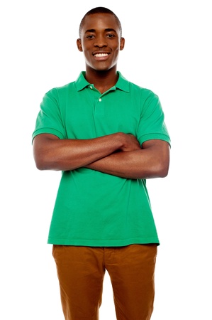 Smiling african guy with crossed arms against white backgroundの写真素材