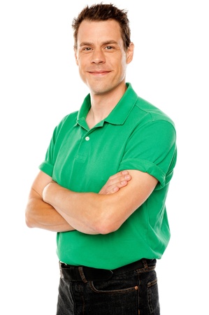 Casual young man with crossed arms isolated over whiteの写真素材