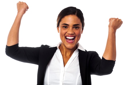 Businesswoman clenching her fists in excitementの写真素材