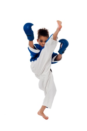 Active little girl practicing upper kickの写真素材