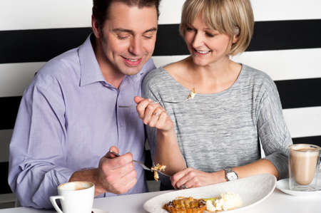 Couple enjoying vegetarian and healthy breakfast.