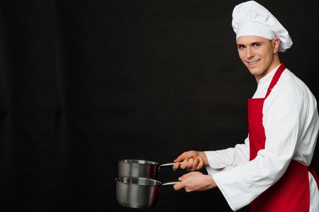 Chef holding empty vessels in both handsの写真素材