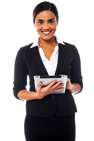 Smiling young businesswoman operating tablet pcの写真素材