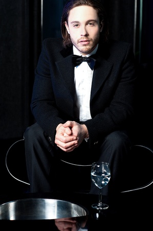 Elegant young man at business partyの写真素材
