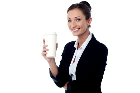 Smiling relaxed businesswoman with beverageの写真素材