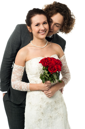 Man whispering into the ears of a brideの写真素材