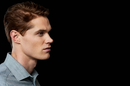 Handsome guy over black backgroundの写真素材