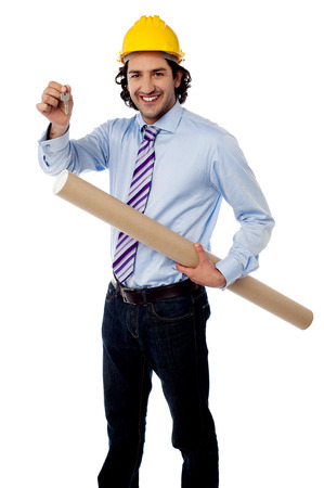 Construction worker with hard hat is holding blueprintの写真素材